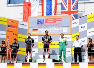 Sandy Stuvik (center) stands on the podium as the Thai national anthem is played at the end of race 2 of the opening weekend of the EuroFormula Open at the Nurbürgring in Germany, Sunday, May 4.