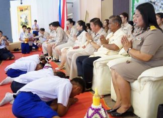 Pattaya School No. 11 students prostrate themselves before their teachers and school administrators as a sign of respect at the beginning of the school year.