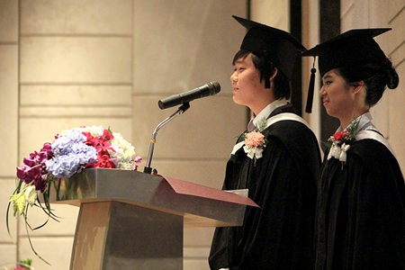 Head Boy and Head Girl for 2013-2014, Kun Woo and Joyce, address their fellow graduates.