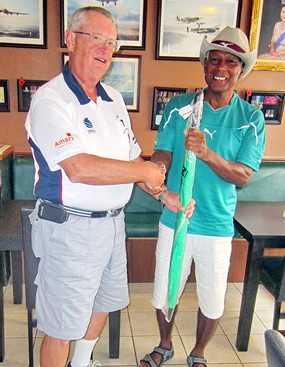 Dick Warberg (left) presents the MBMG Group Golfer of the Month award to Landis Brooks.