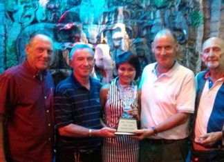 Jean Morel Memorial winners, Donal McGuigan and Declan Kelly, receive the trophy from Khun Tookta, flanked by David Thomas and Len Jones.