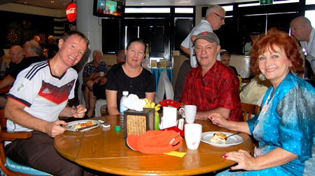 Elfie Seitz, executive editor of the German language Pattaya Blatt newspaper, enjoys breakfast with friends before the start of the presentation by Dr. Mettananando to the PCEC.