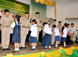 Officers at Sattahip Naval Base recently handed out 621,000 baht in scholarships to families of navy personnel.