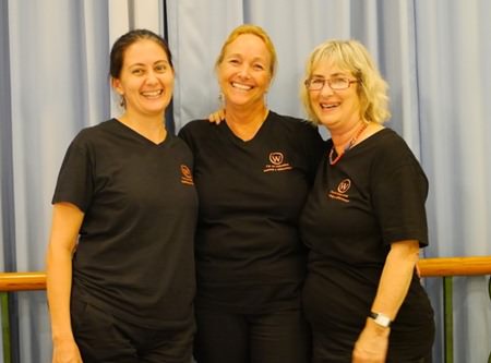 Women with a Mission’s Kylie Grimmer, Rosanne Diamente and Bronwyn Carey gather for a group photo at their last fundraising golf tournament at Phoenix golf course.