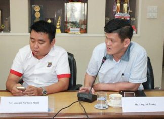 Penang City Councilmen Ong Agteong (right) and Joseph Ng Soong Siang learn how Pattaya is managing its beaches during a visit to city hall.