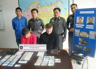 Evgenii Kurbatov (left) and Sergei Popov (right) were apprehended with 36 fake ATM cards and cash.