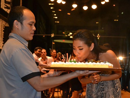 Kamonrat Ladseeta (Emmy) blows out the candles on her birthday cake.