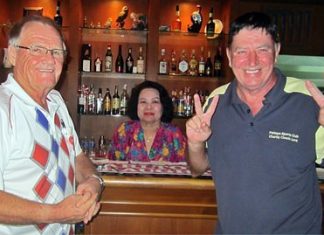 Winners Derek Brook (left) and John Hackett (right) celebrate with Lek at BJ’s Holiday Lodge.