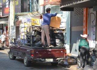 Morning on Walking Street - buyers arrive to buy bottles and papers from Pattaya’s hidden army of scavengers.