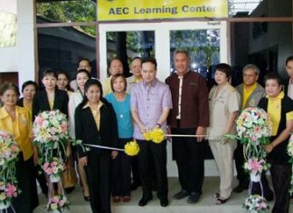 Officials cut the ribbon to officially open the new AEC Learning Center.