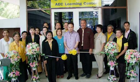 Officials cut the ribbon to officially open the new AEC Learning Center.