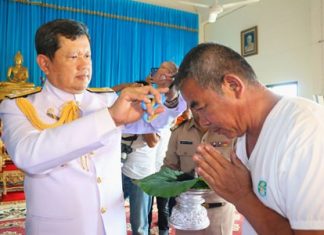 Vice Adm. Viphak Noijinda presides over the head-shaving ceremony for the 74 monks-to-be, who will be ordained Dec. 5 at Khao Bamphenbun Temple in Najomtien.