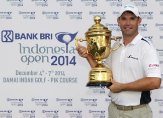 Padraig Harrington holds the champions trophy after winning the 2014 BANK BRI Indonesia Open at the Damai Indah Golf, PIK Course in Jakarta, Sunday, Dec. 7.