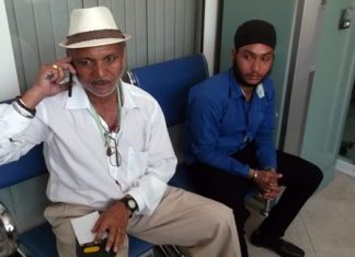 Hukam (left) and Gurpreet Singh (right) were arrested for working without a permit for allegedly charging tourists to read their fortunes.