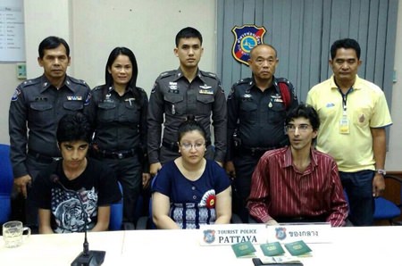 Adil Hueeani, his wife Surayya and one of their children are shown during the press briefing announcing their arrest.