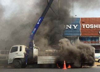 This careless crane driver touched high-voltage lines with the vehicle’s basket, setting off a fire that torched the truck’s back wheels.