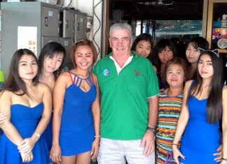 Russell (centre) poses with the staff at Blue Sky Bar.