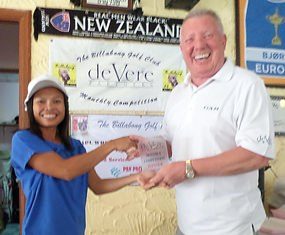 Orn (left) receives the deVere monthly trophy from Brian Chapman.