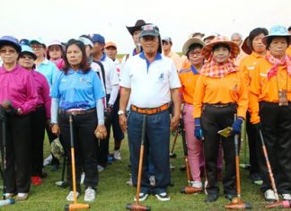 Competitors line up for the seniors woodball tournament at the Nawikayothin Headquarters in Sattahip on Saturday, Feb. 7.