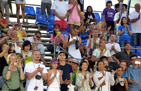 Spectators applaud both players at the end of a pulsating singles final.