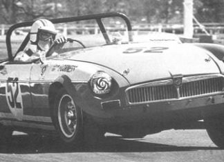 Dr Iain Corness drives his race-modified MGB in this undated photo.