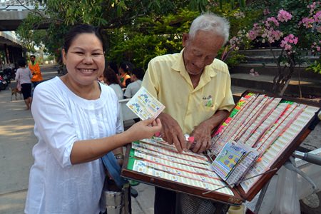 People are able to buy lottery tickets at their temples after they make merit.