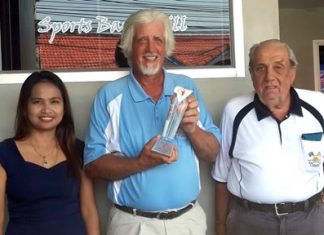 Jimmy Little (centre) celebrates winning his first ever monthly golf tournament.