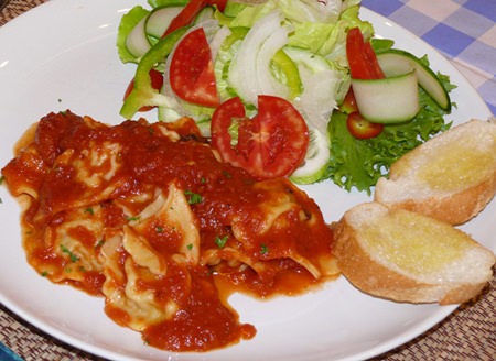 Minced pork and three mushrooms ravioli with a pomodoro sauce.