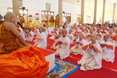 61 novices prepare to be ordained by Tasanee Kunakorn, abbot of Sattahip Temple.