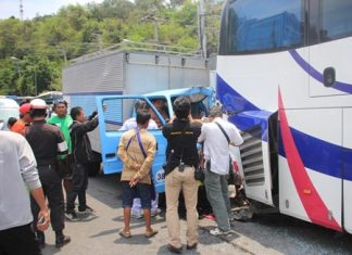 Surat Thai-oun and passenger Worachai Sripanoun were pinned in their truck when it slammed into the back of a tour bus.