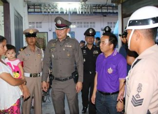 Sattahip police and administrative officials meet with migrant laborers to ease wariness of authorities and investigate possible cases of human trafficking.