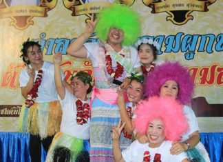 Father Phu with a green wig and his dancers.