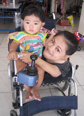 This is me with mom in our new wheelchair.