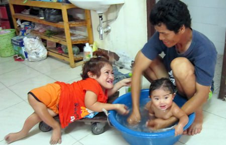 This is me getting a bath from my mom and dad.