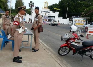 A sailor is stopped at an inspection station on his way in to the base, as part of the Navy’s crackdown on on-duty drinking.