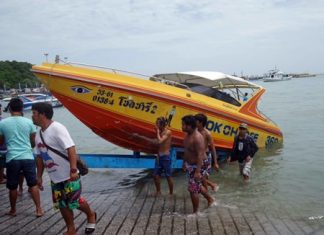 The Chok Charlee 2 is brought ashore after nearly sinking about a nautical mile off Bali Hai Pier.