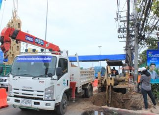 Workers begin digging holes for the new footbridge foundation piles near the Bangjak gas station.