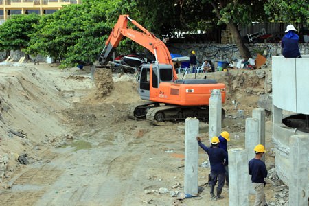 Construction staff from PSI Engineering work the drainage area near the Dusit curve in North Pattaya.