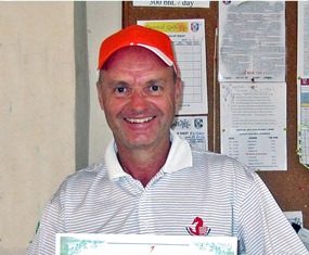 Anders Pederson displays a winning smile and his hole-in-one certificate.