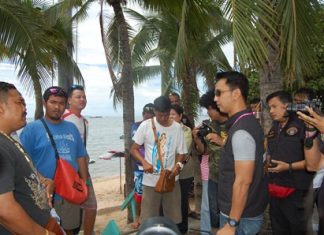 A team of officers from Bangkok’s Crime Suppression Division, Marine Police, Tourism Police, Immigration Division, and Pattaya Police Station question jet ski vendors along Pattaya Beach. Jet ski vendors were put on notice they are being watched after police rounded up and collected information on nearly six dozen Pattaya Beach operators accused of perpetrating extortion scams against tourists.