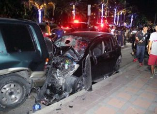 A woman lies dead in the street (background) after being struck by a car (foreground) driven by an unlicensed 17-year-old boy.