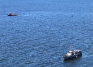 Helicopter crews and divers took a final shot at finding four crewmen of a containership that sank near the mouth of the Chao Phraya River, but failed to find their bodies.