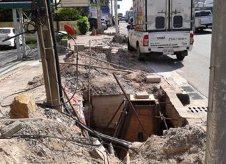 Workers from Bang Saen Mahanakhon begin repairs to bricks and drain covers caused by demolition of the street in order to relocate electrical cables and water pipes.