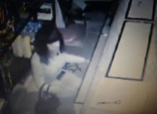 Video footage from a security camera shows a transgender guest breaking into the cash drawer at 3:45 a.m.