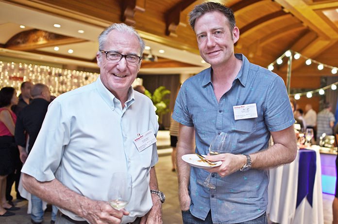 Dr. Iain Corness and his tall son Jonathan Corness.