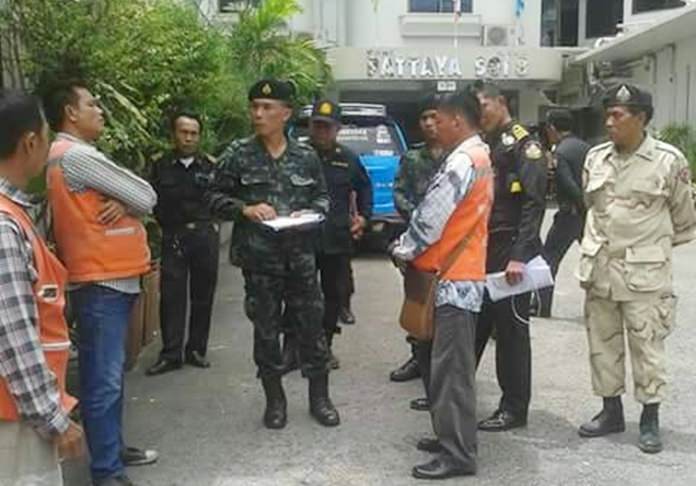 Pattaya city and military officials inspect motorbike taxi stands in South Pattaya to determine if a new registration system is working.