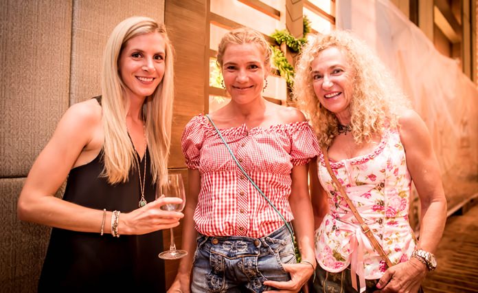 A trio of smiles at Oktoberfest Pattaya.