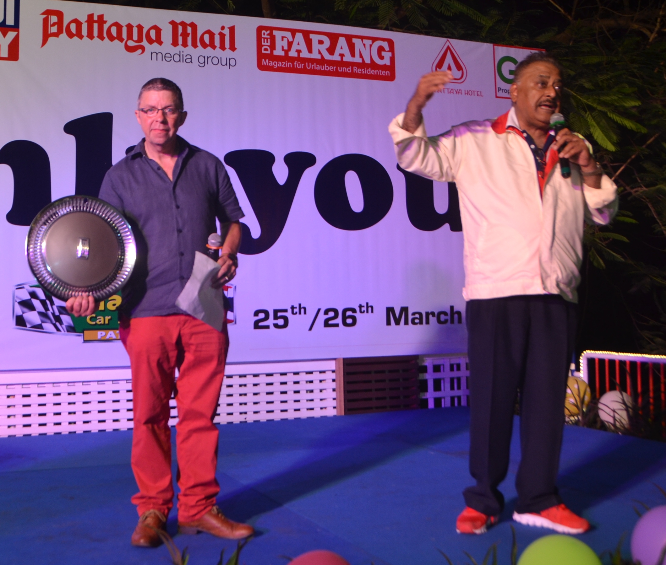 Paul Strachan and Peter Malhotra conduct the auction helping to raise over 100,000 baht.