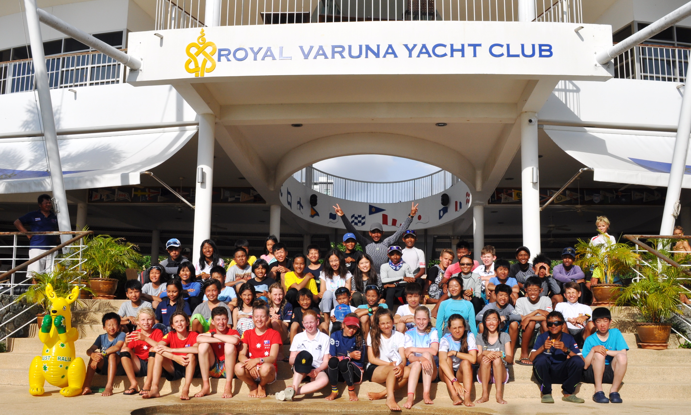 Young Thai and international sailors pose for a group photo at Royal Varuna Yacht Club.