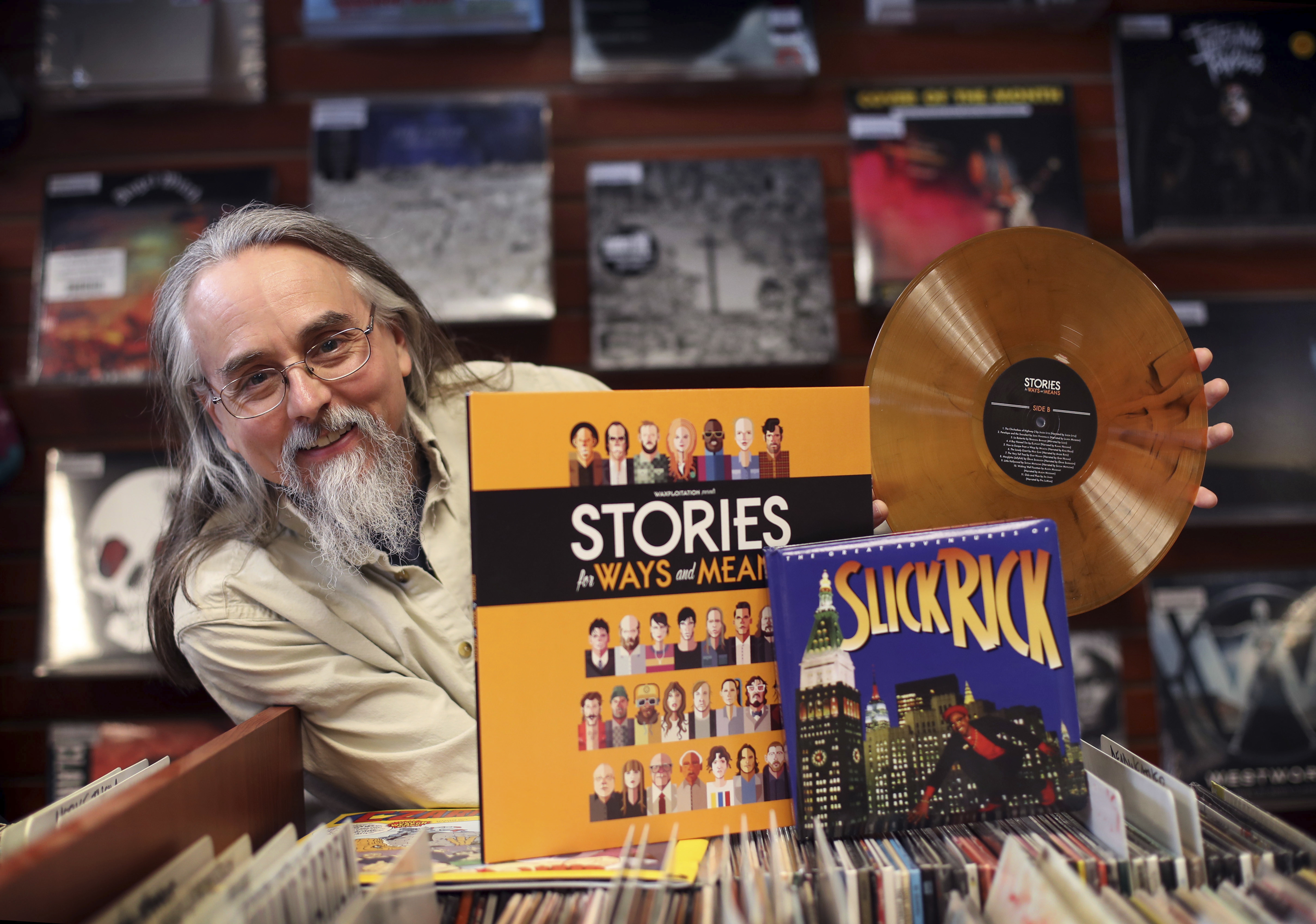 Chris Brown poses with and an orange vinyl album at Bull Moose Music in Portland, Maine, Friday, April 14. (AP Photo/Robert F. Bukaty)